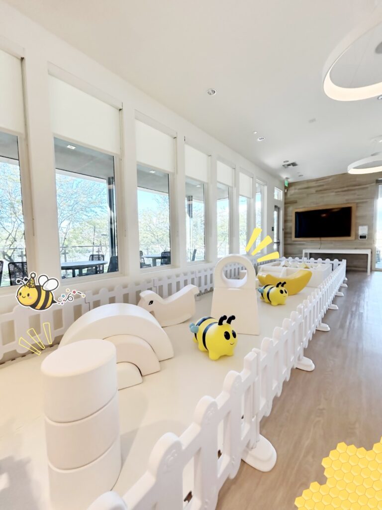 White soft play with bumblebee hoppers at an indoor venue
