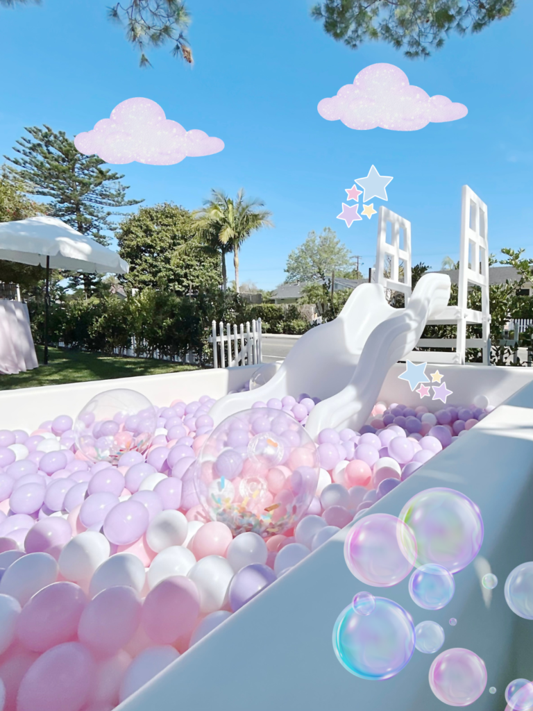 Light pink ball pit with bubbles and cloud decor