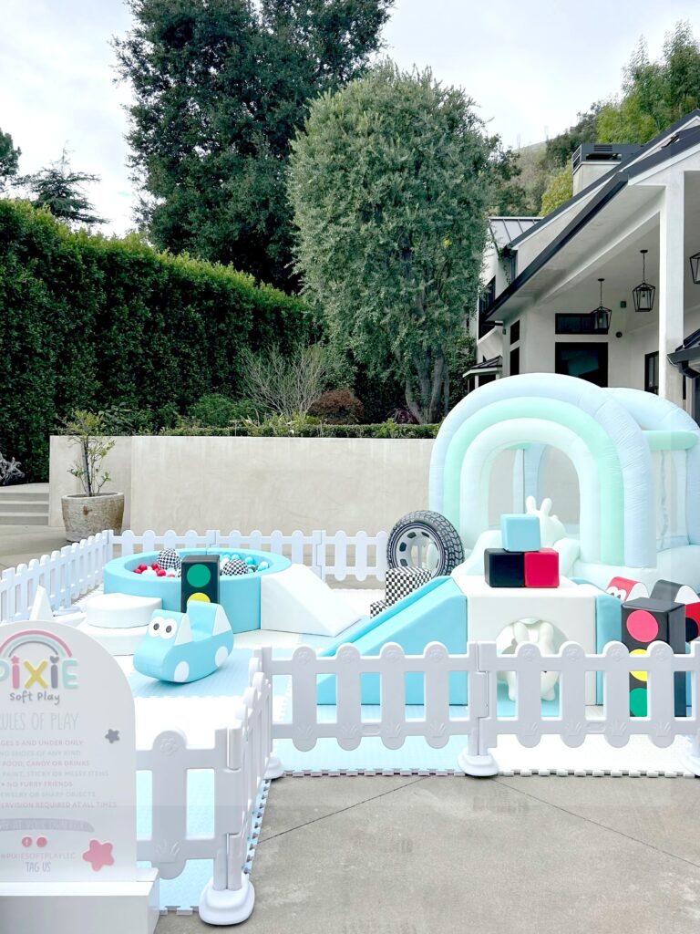 Light blue race car theme soft play in a backyard